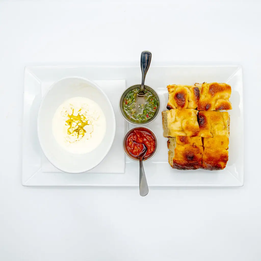 Focaccia with house-made dipping sauces at Alfreda